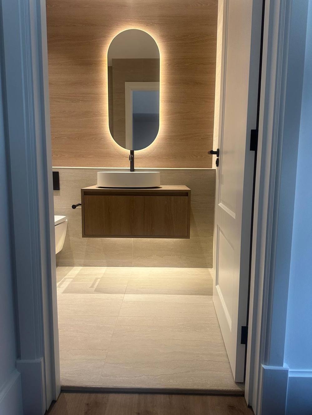 Cloakroom with a backlit mirror, maisonette refurbishment